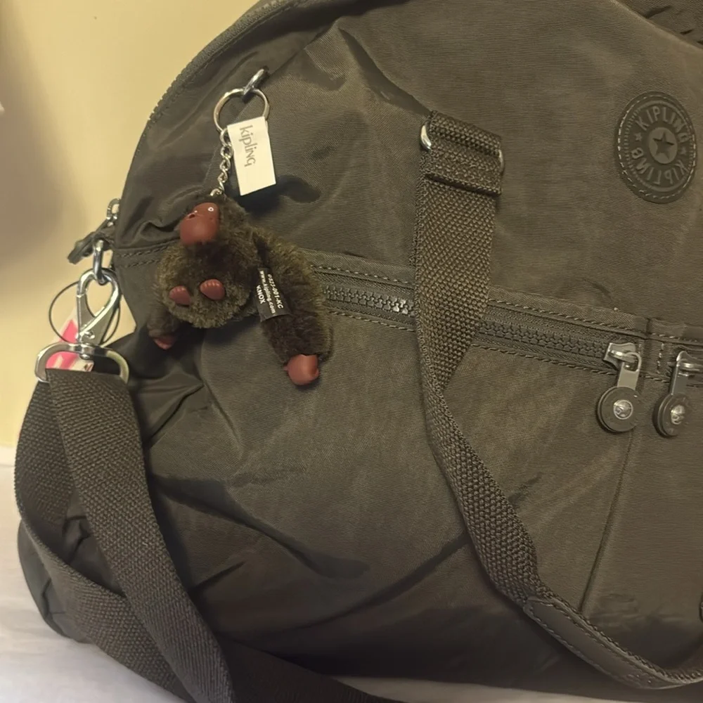 Kipling Black Duffel Bag, new, outside pockets, inside pockets, unisex